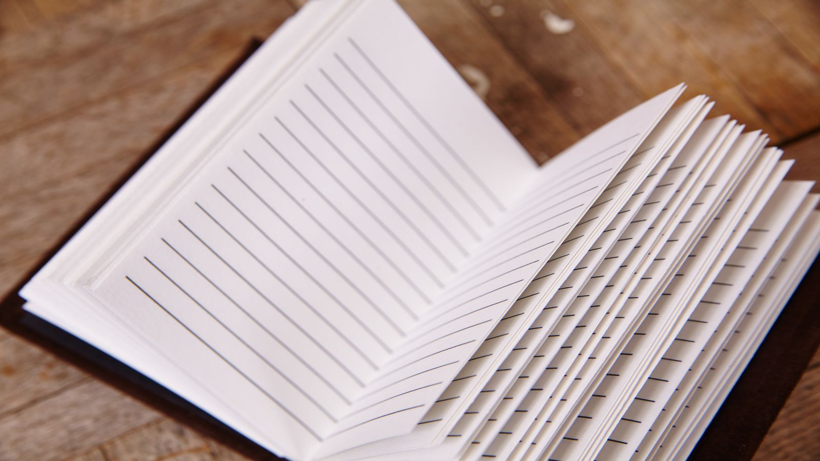 Stack of engineering journal pages with annotations and margin notes